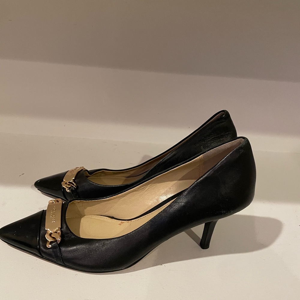 Coach black pump with gold hardware size 7B.